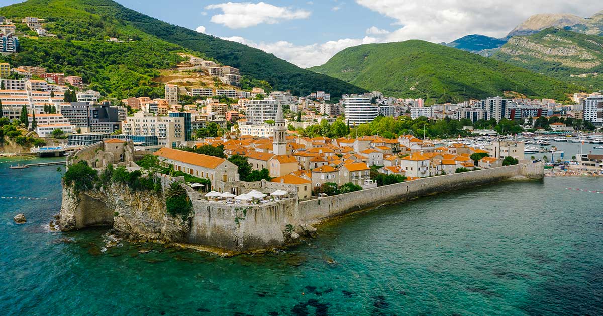 Beach wedding in Montenegro – ceremony in the Bay of Kotor with mountains in the background