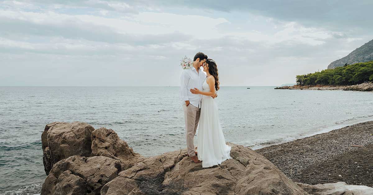 Best beaches to get married in Europe – wedding ceremony at sunset overlooking the Mediterranean sea